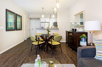 Living room and dining room with a table and chairs at Avino in 92130